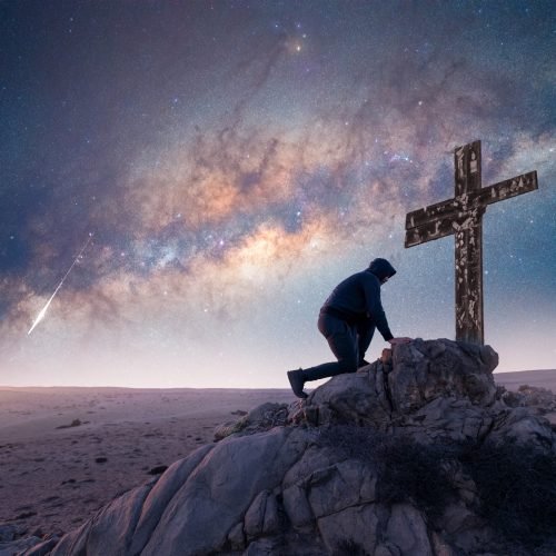 unknown-person-praying-by-cross-top-mountain-milky-way